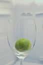 Fresh raw green lime in a chilled wine glass
