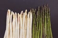 Fresh raw green and white asparagus spears on black background, close-up, copy space Royalty Free Stock Photo