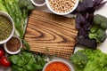 Fresh raw ingredients for cooking vegetarian food. Vegatables and beans, cutting board close up. Menu food background Royalty Free Stock Photo