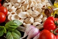 Fresh raw  italian pasta orecchiette, vegetables, herbs and olive oil Royalty Free Stock Photo