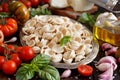 Fresh raw  italian pasta orecchiette, vegetables, herbs and olive oil Royalty Free Stock Photo