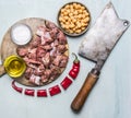 Fresh raw lamb chop on a cutting board for meat cleaver Meat fork herbs top view close up wooden rustic background Royalty Free Stock Photo