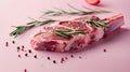 Fresh raw lamb chop with rosemary and peppercorns on pink background. Gourmet meal preparation, culinary arts and Royalty Free Stock Photo