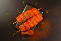 Chicken breast Fillets.Fresh raw marinated chicken fillet skewers with fresh herbs on a black background.Closeup of Royalty Free Stock Photo