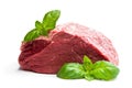 Fresh raw meat beef piece with basil leaf isolated on white background