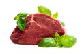 Fresh raw meat beef piece with basil leaf isolated on white background