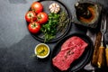 Fresh raw meat beef steak. Beef tenderloin, spices, herbs and vintage cutlery. Food background with copy space Royalty Free Stock Photo