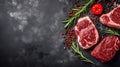 Fresh raw meat beef steaks on black wooden background, top view, text copy space, Red meat steaks, spices, herbs, seasoning