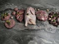 Fresh raw meat. Different types of raw pork meat, chicken, beef, turkey giblets with herbs on dark marble, copy space Royalty Free Stock Photo