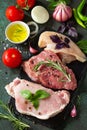 Fresh raw meat. Different types of raw pork meat, chicken fillet and beef with vegetables and herbs Royalty Free Stock Photo