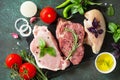 Fresh raw meat. Different types of raw pork meat, chicken fillet and beef with vegetables and herbs Royalty Free Stock Photo