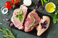 Fresh raw meat. Different types of raw pork meat, chicken fillet and beef with vegetables and herbs Royalty Free Stock Photo