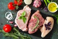 Fresh raw meat. Different types of raw pork meat, chicken fillet and beef with vegetables and herbs Royalty Free Stock Photo