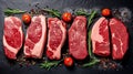 Fresh raw meat on slate black board top view, Variety of raw beef steak, spices, seasoning, herbs for cooking, grilling Royalty Free Stock Photo