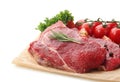 Fresh raw meat with spices, herbs tomatoes on white background Royalty Free Stock Photo
