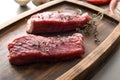 Fresh raw meat with thyme on wooden tray Royalty Free Stock Photo
