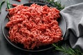 Fresh Raw mince, Minced beef, ground meat with herbs and spices on black plate Royalty Free Stock Photo