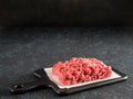 Raw minced beef on light gray cement background Royalty Free Stock Photo