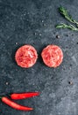Fresh raw minced beef steak for burgers on black background with rosemary, chili pepper and spice Royalty Free Stock Photo