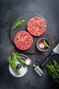 Fresh raw minced beef steak burgers with spices Royalty Free Stock Photo