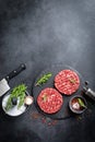 Fresh raw minced beef steak burgers with spices Royalty Free Stock Photo