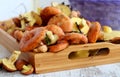 Fresh raw mushrooms . Autumn mushrooms on a wooden rustic table. Forest mushrooms on a wooden tray Royalty Free Stock Photo