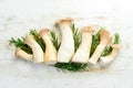 Fresh raw mushrooms, king oyster or eringi on white wooden background background. Mushrooms. Royalty Free Stock Photo