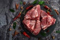 Fresh raw mutton shoulder meat isolated on black stone background with spices Royalty Free Stock Photo