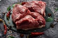 Fresh raw mutton shoulder meat isolated on black stone background with spices Royalty Free Stock Photo