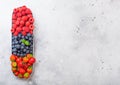 Fresh raw organic berries in in stainless steel tray on kitchen table background. Space for text. Top view. Strawberry, Raspberry, Royalty Free Stock Photo