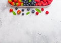 Fresh raw organic berries in in stainless steel tray on kitchen table background. Space for text. Top view. Strawberry, Raspberry, Royalty Free Stock Photo