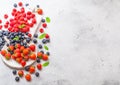 Fresh raw organic berries on vintage chopping boards on kitchen table background. Space for text. Top view. Strawberry, Raspberry, Royalty Free Stock Photo