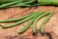 Fresh Raw Organic French Green Beans Haricot Verts, or Filet Beans on olive wood. Royalty Free Stock Photo