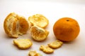 Peeled tangerine or mandarin fruit on white background cutout