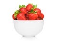 Fresh raw organic strawberries in white ceramic bowl plate on white background Royalty Free Stock Photo