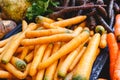 Fresh raw organic uncooked carrot vegetables for sale at farmers market. Vegan food and healthy nutrition concept. Top view Royalty Free Stock Photo