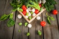 Fresh raw organic vegetables on a rustic wooden table in basket: spinach, broccoli, Brussels Royalty Free Stock Photo