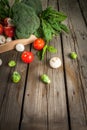 Fresh raw organic vegetables on a rustic wooden table in basket: spinach, broccoli, Brussels Royalty Free Stock Photo