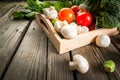 Fresh raw organic vegetables on a rustic wooden table Royalty Free Stock Photo