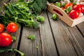 Fresh raw organic vegetables on a rustic wooden table Royalty Free Stock Photo