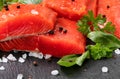 Fresh raw pacific wild sockeye salmon fillets on natural stone with spices and basil leaves Royalty Free Stock Photo