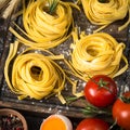 Fresh raw pasta tagliatelle and ingredients Royalty Free Stock Photo