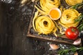 Fresh raw pasta tagliatelle and ingredients Royalty Free Stock Photo