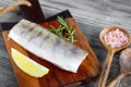 Fresh raw pike perch fish fillet on cutting board Royalty Free Stock Photo