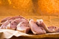 Fresh raw pork chops on a cutting board. Arrangement on the wr Royalty Free Stock Photo