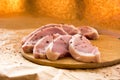 Fresh raw pork chops on a cutting board. Arrangement on the wr Royalty Free Stock Photo