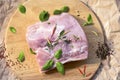 Fresh raw pork chops on a cutting board  on the wrapping paper Royalty Free Stock Photo