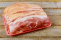 Fresh raw pork chops meat in a bag on chopping board on desk Royalty Free Stock Photo