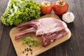Fresh Raw Pork Chops and vegetable on wooden background. Royalty Free Stock Photo