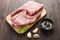 Fresh Raw Pork Chops on wooden background. Royalty Free Stock Photo